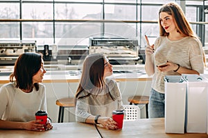 Women waiting for their late friend at coffee-shop