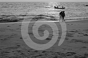 Women walking through beach