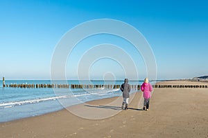 Women walking on the beach