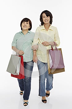 Women walking hand in hand