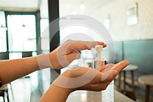 Women washing hands with alcohol gel for protective Hygiene concept. image for healthy, covid19, epidemic, and people