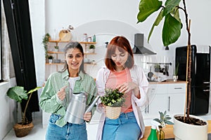 Women with a watering can and a houseplant