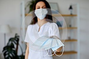 Women wear a glove and holding a protective mask. Medicine concept