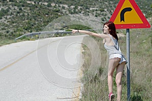 Women wear hot clothes hide a traffic sign danger turn