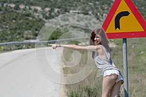 Women wear hot clothes hide a traffic sign danger turn