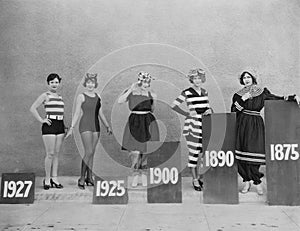 Women wearing fashions of different eras photo