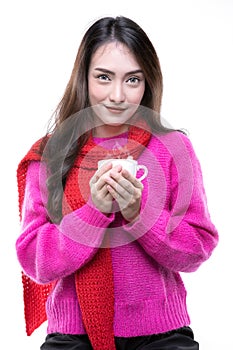 Women wearing a sweater ,holding a cup of coffee
