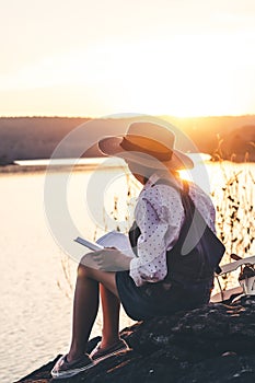 Women in winter sit read favorite book in the holiday, Concept girl reading a book