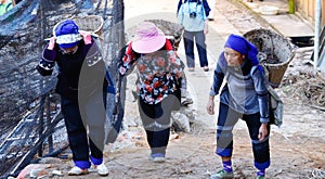 Women at work in a village near the rice fields of Yunnan, China.