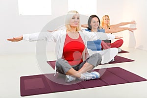 Women working out on mat