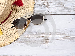 Womens accessories straw hat, sunglasses. Fashion outfit, spring summer collection. Shopping concept. Flat lay, view from above