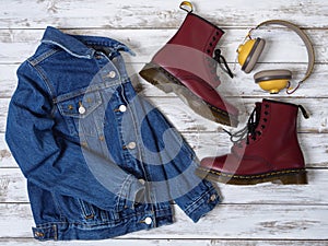 Womens clothing, accessories, footwear burgundy boots, yellow wireless headphones, denim jacket. Fashion outfit. Shopping