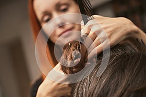 Womens fashion and style. Hair care, beauty industry concept. Hairdresser doing haircut closeup of work. Hairstylist