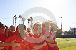 Womens Football Team In Huddle Having Motivational Pep Talk Before Soccer Match