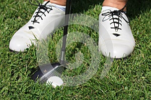 Womens golf shoes and golfball