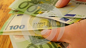 Womens hands count euro bills.Expenditures and earnings of women in Europe.Money accumulations and savings.