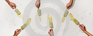 Womens hands taking matcha coconut popsicles from table with ice