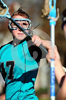 Womens Lacrosse Player blocking