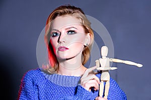 Womens power. women rule the world. sexy woman with fashion makeup. wooden figure in hand of girl. natural beauty