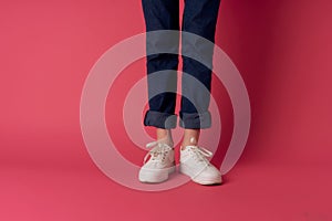 womens shoes cropped view posing pink background