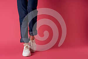 womens shoes cropped view posing pink background