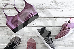 Womens sport bra and two pairs of sneakers violet, black and wh