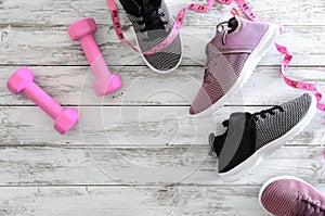 Womens sport footwear sneakers and equipment pink dumbbells,