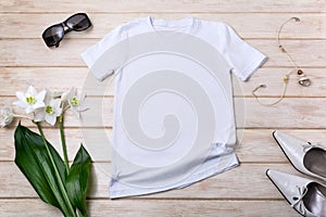 Womens white T-shirt mockup with lily flowers, green leaves