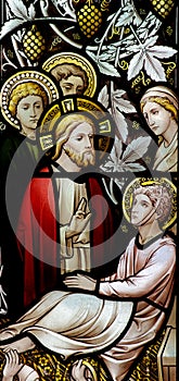 Wonder of Jesus: curing a sick man in stained glass photo