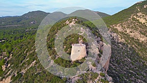 Wonderful aerial view flight drone Sunset cliff hiking Ibiza island tower Spain