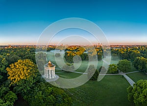 Wonderful aerial view over the Englischer Garten of the bavarian capital Munich at the early morning with fog in the