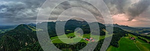 Wonderful aerial view over idyllic farmland in mountainrange to the bavarian alps at the recreation and hiking aera