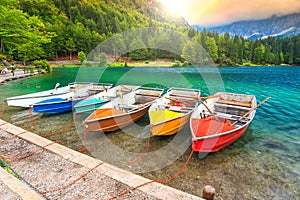 Wonderful alpine landscape and colorful boats,Lake Fusine,Italy,Europe