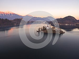 Wonderful Bright Autumn landscape during sunset. Awesome Fairy tale lake Bled in Julian Alps, Slovenia, Europe.