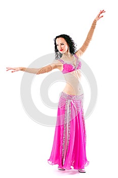 Wonderful brunette in the pink dress of an oriental dancer