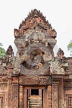 Wonderful carvings in the kudu-arch at the temple.Banteay Srei temple, Siem Reap, Cambodia, Asia