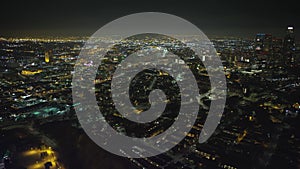 Wonderful drone view of night los angeles, heading towards downtown, flying over cottages, beautiful night city panorama