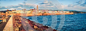 Wonderful evening cityscape of Alghero town, Province of Sassari, Italy, Europe. Panoramic summer view of Sardinia island, Mediter