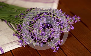A wonderful fragrant bouquet of lavender on a wooden table.