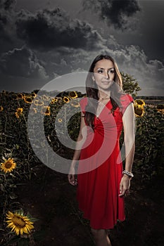 Wonderful girl in field of sunflowers