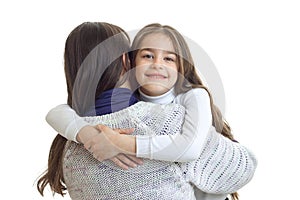 Wonderful girl hugs her mother back and smiling