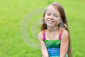 Wonderful girl sitting on the lawn