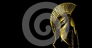 A wonderful golden spartan helmet as part of the equipment of ancient Greek soldiers