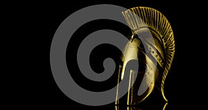 A wonderful golden spartan helmet as part of the equipment of ancient Greek soldiers.