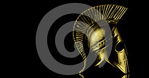 A wonderful golden spartan helmet as part of the equipment of ancient Greek soldiers