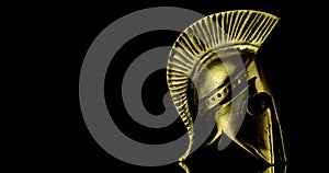 A wonderful golden spartan helmet as part of the equipment of ancient Greek soldiers