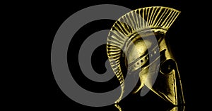 A wonderful golden spartan helmet as part of the equipment of ancient Greek soldiers