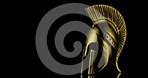 A wonderful golden spartan helmet as part of the equipment of ancient Greek soldiers