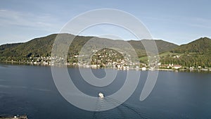 Wonderful Lake Tegernsee in autumn 4k Aerial. Boat is on the water. Bavaria, Germany Rottach. The lake is one of the