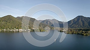 Wonderful Lake Tegernsee in autumn 4k Aerial. Boat is on the water. Bavaria, Germany Rottach. The lake is one of the